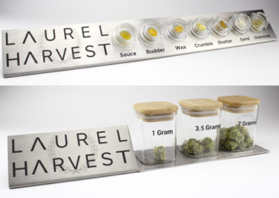 Custom engraved stainless steel hash display and flower display with logo and names of concentrates. Fake sauce, fake budder, fake wax, fake crumble, fake shatter, fake crumble, fake sand, fake diamonds. Fake weed cannabis flowers in 1 gram, 3.5 grams, 7 grams.